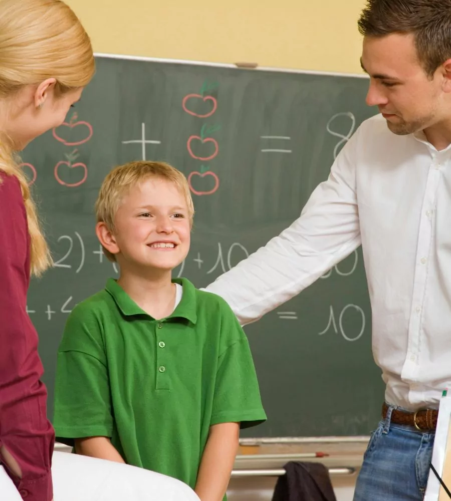 Boy with teacher and parent